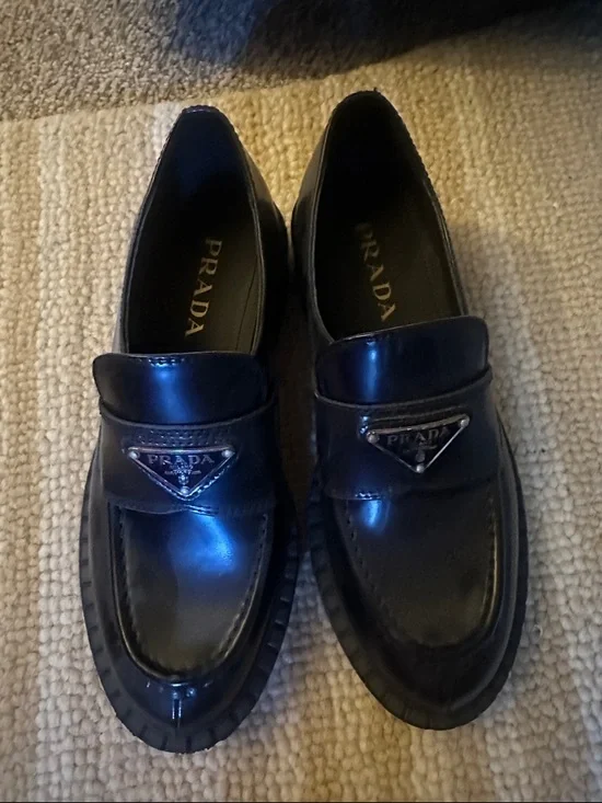 Black Leather Penny Loafers with Metal Triangle Logo - Picture 1 of 3